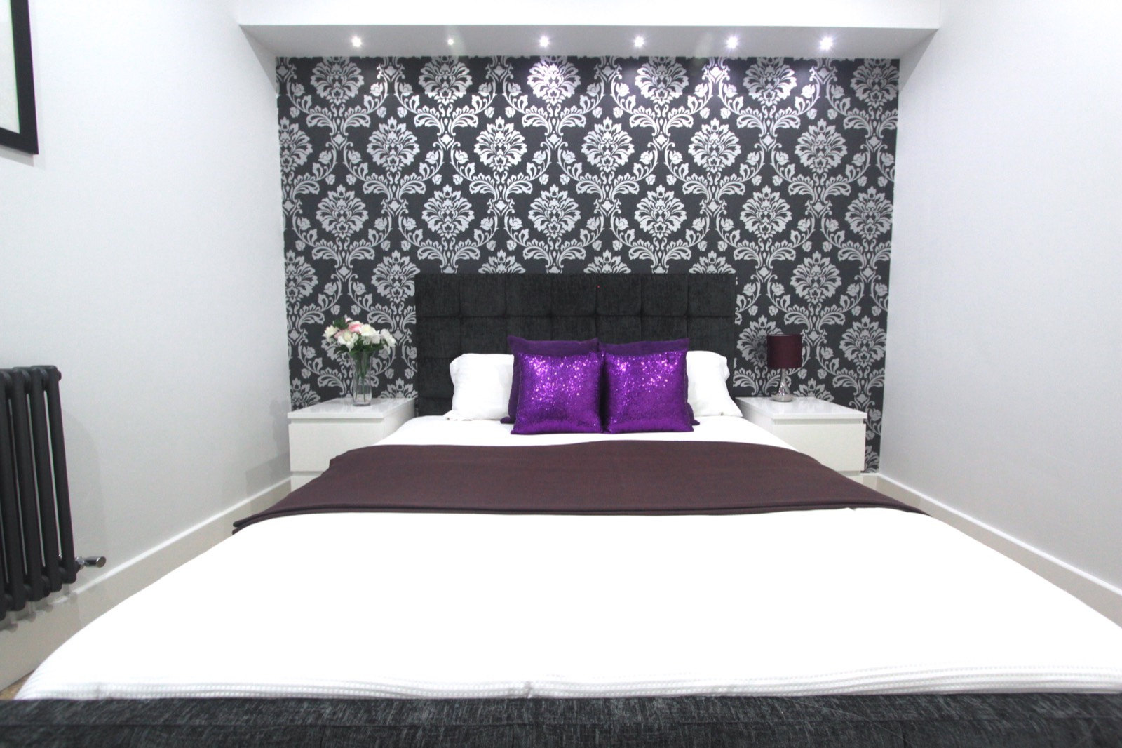 Double bedroom with patterned feature wall