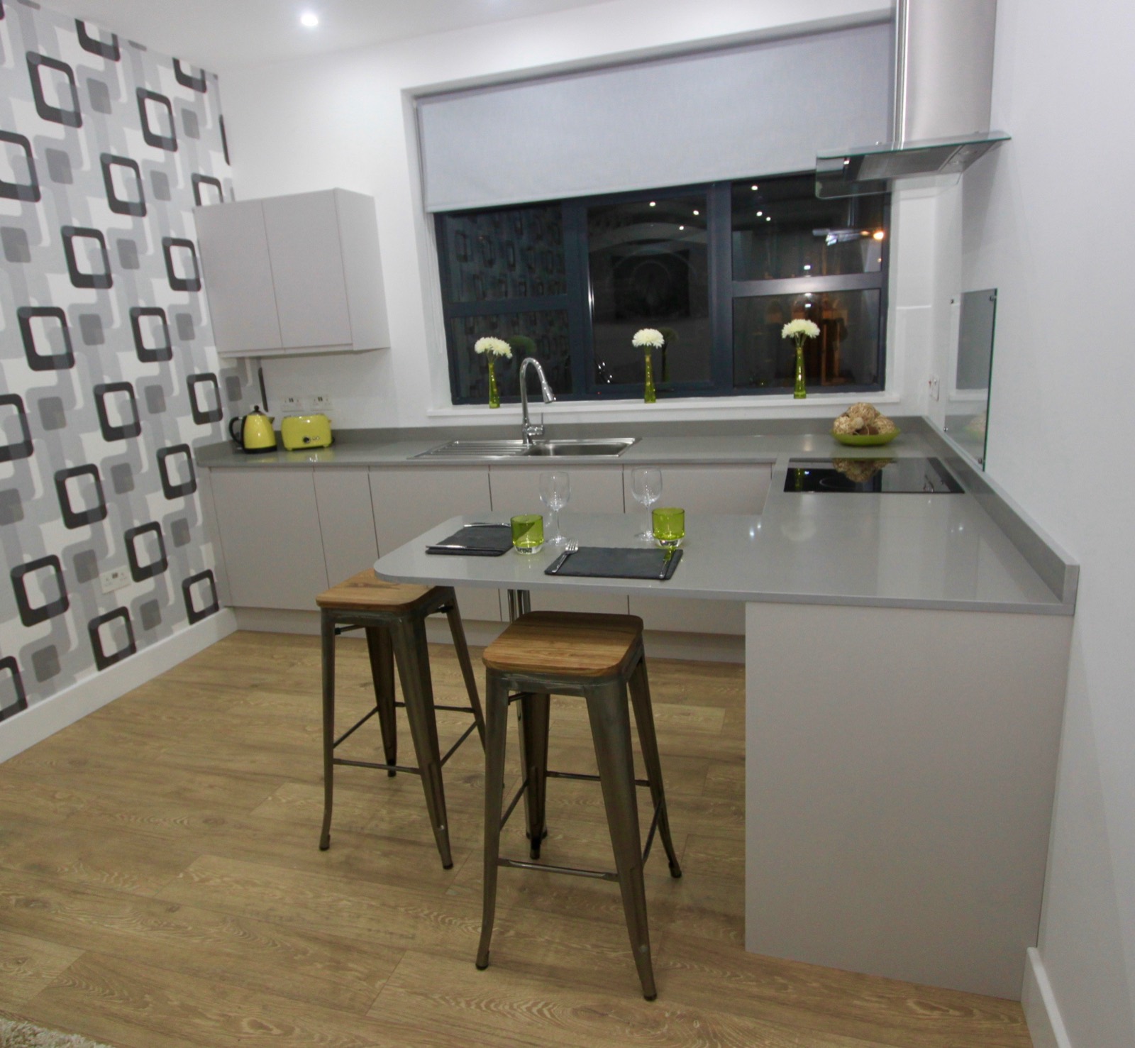 Bright kitchen with breakfast bar and bar stools