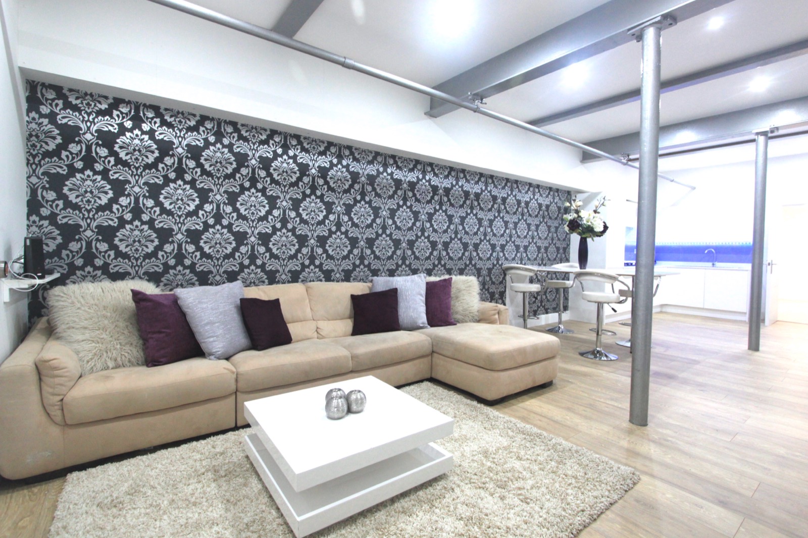 Shared lounge with sofas and dining table